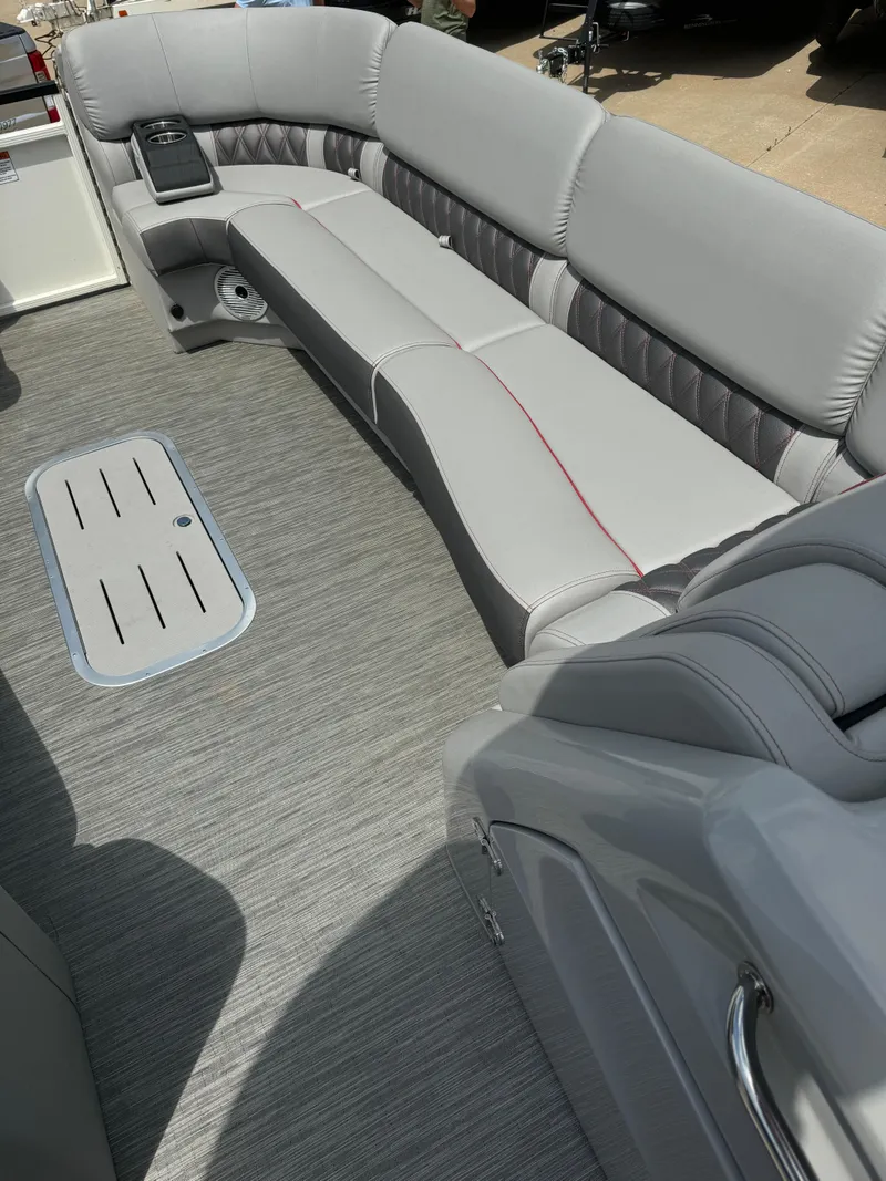 Slide: The Image of 2022 Bennington 28 QXFBA boat interior with gray seating and flooring. - 11