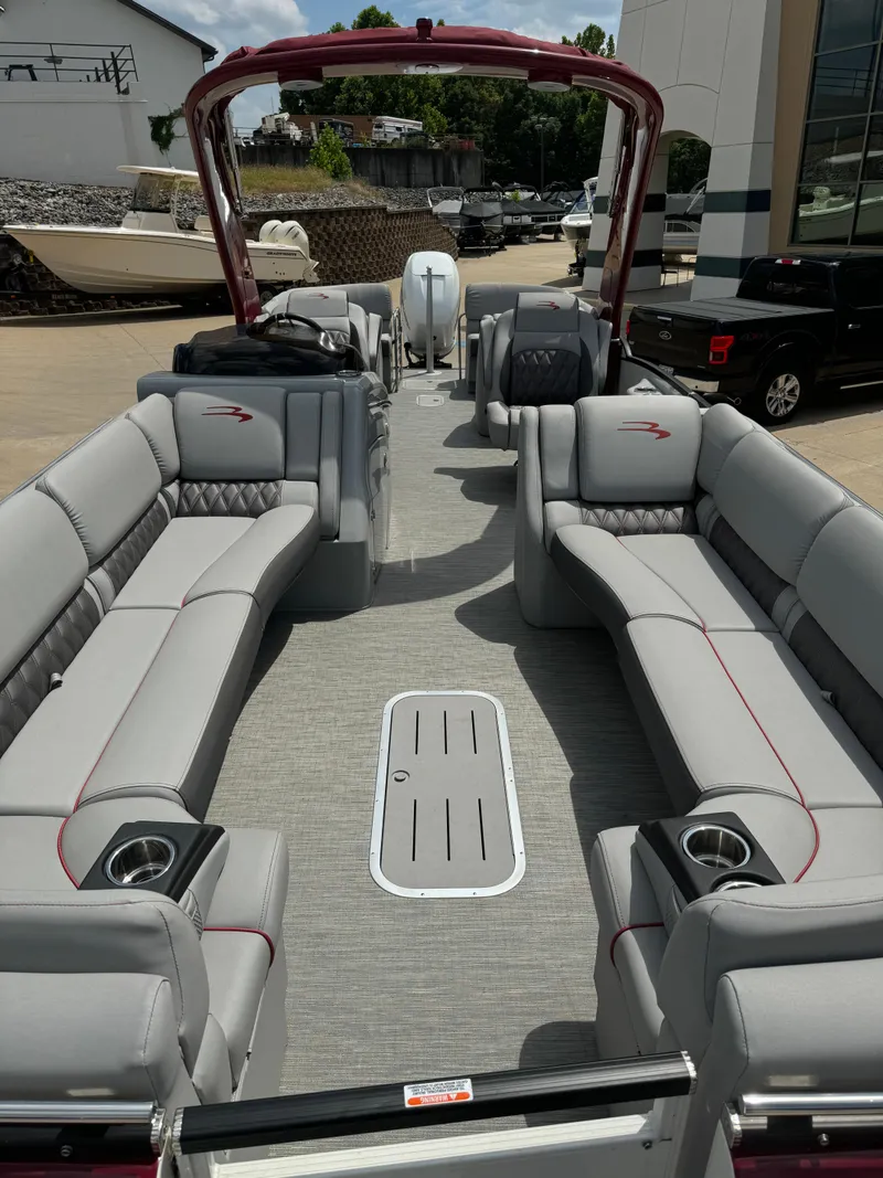 Slide: The Image of 2022 Bennington 28 QXFBA pontoon boat with spacious seating and modern design. - 12