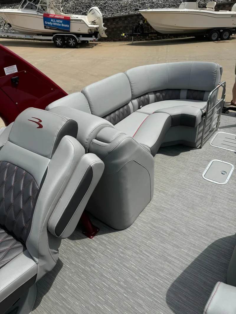 Slide: The Image of 2022 Bennington 28 QXFBA luxury pontoon boat with plush seating and modern design. - 15
