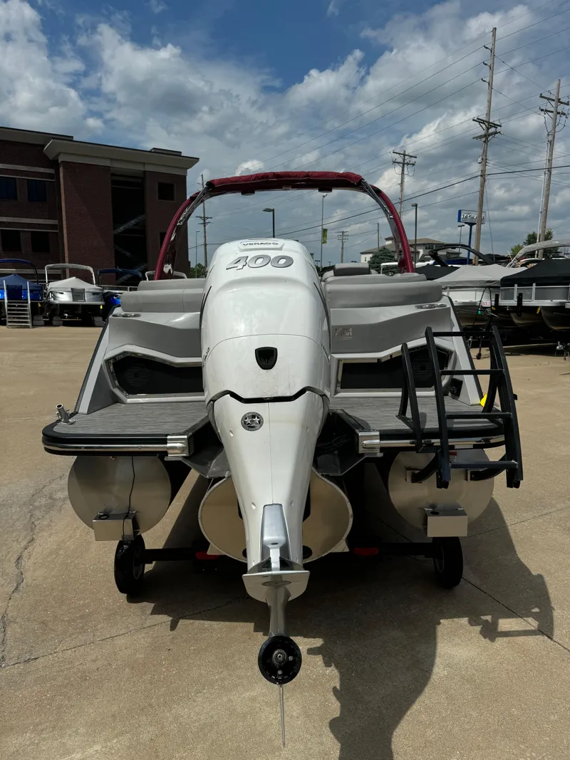 Slide: The Image of 2022 Bennington 28 QXFBA pontoon boat rear view in a dealership lot. - 5