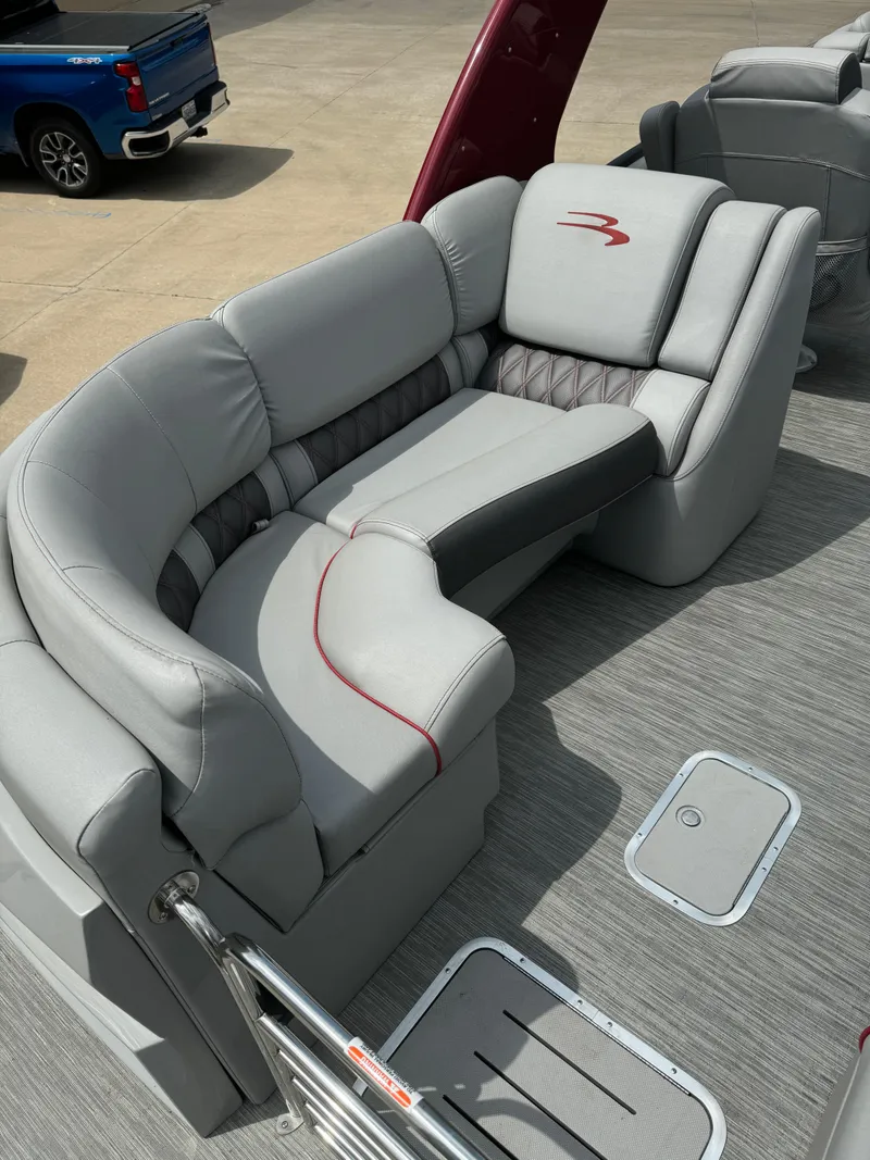 Slide: The Image of 2022 Bennington 28 QXFBA boat interior with luxurious gray seating. - 6