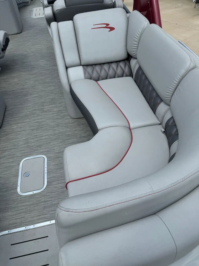 Slide: The Image of 2022 Bennington 28 QXFBA boat interior with luxurious seating. - 7