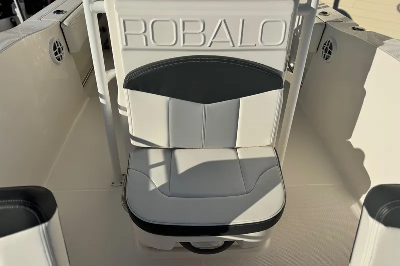 Slide: The Image of 2023 Robalo R202 Explorer boat seat with embossed logo and sleek design. - 4