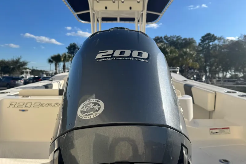 Slide: The Image of 2023 Robalo R202 Explorer boat with 200 horsepower engine, sunny day background. - 8