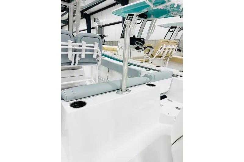Slide: The Image of 2026 Sportsman Heritage 231 Center Console interior with seating and rod holders. - 11