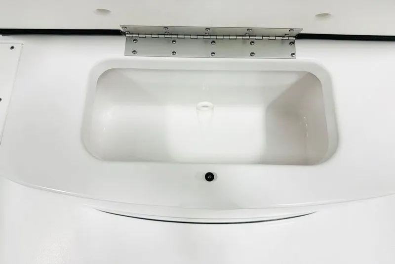 Slide: The Image of 2026 Sportsman Heritage 231 Center Console livewell, white interior, stainless steel hinge. - 14
