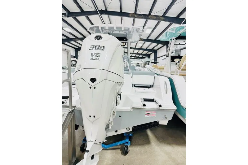 Slide: The Image of 2026 Sportsman Heritage 231 Center Console with powerful 300 V6 engine in showroom. - 15