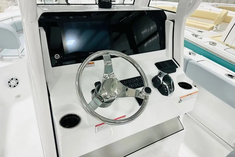 Slide: The Image of 2026 Sportsman Heritage 231 Center Console dashboard with steering wheel and controls. - 4