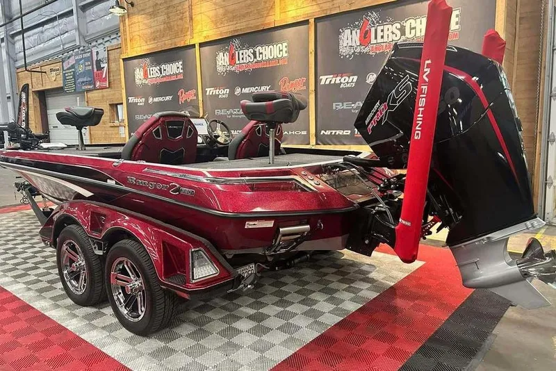 Slide: The Image of 2024 Ranger Z520R Cup-Equipped boat in showroom, featuring sleek design and powerful engine. - 2
