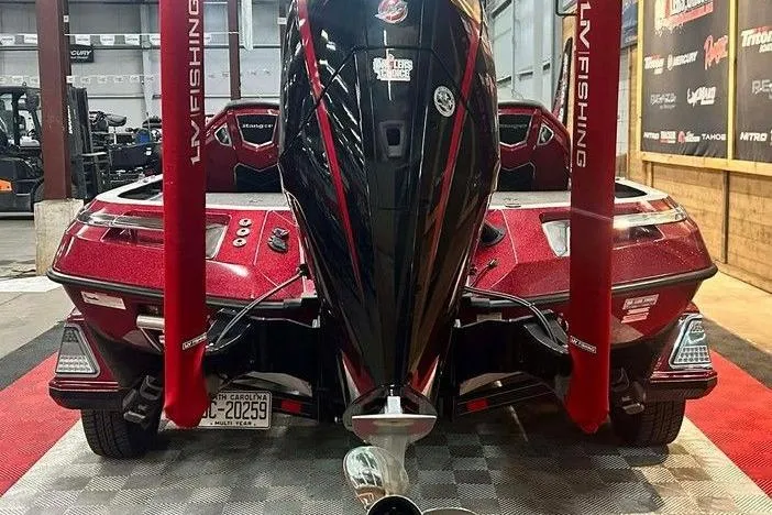 Slide: The Image of 2024 Ranger Z520R Cup-Equipped boat in showroom, rear view with red accents. - 3