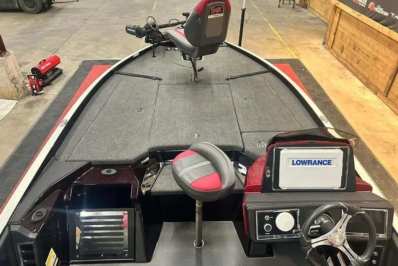 Slide: The Image of 2024 Ranger Z520R Cup-Equipped boat interior with Lowrance electronics and seating. - 5