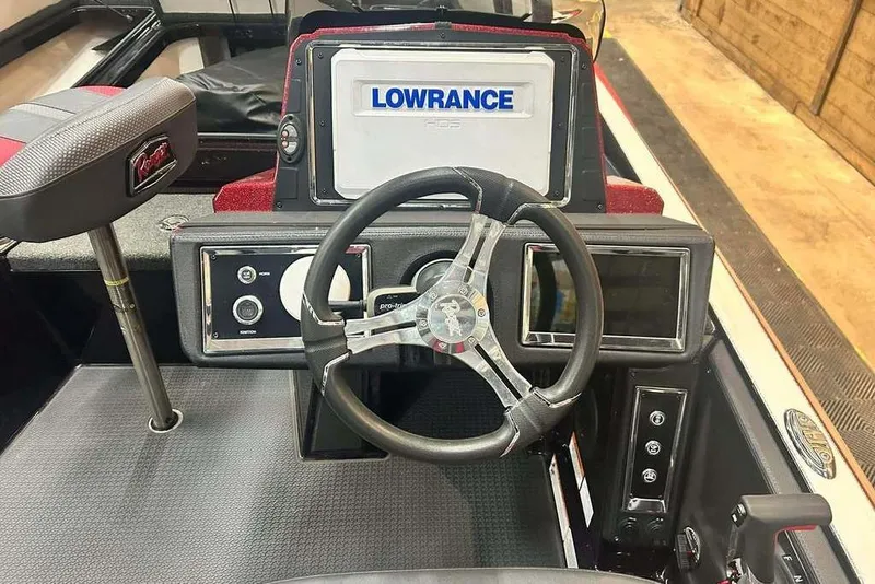 Slide: The Image of 2024 Ranger Z520R Cup-Equipped boat dashboard with steering wheel and Lowrance display. - 6