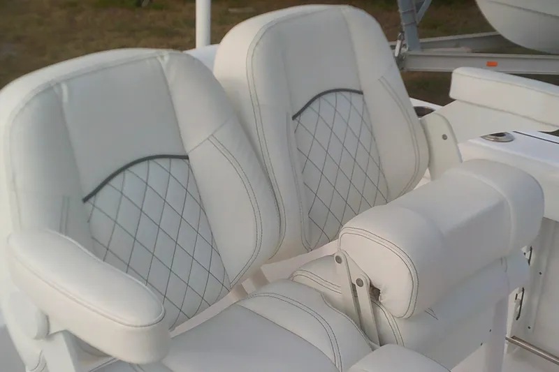 Slide: The Image of 2023 Sportsman Heritage 241 Center Console boat seats with diamond stitching. - 12