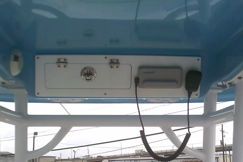 Slide: The Image of 2023 Sportsman Heritage 241 Center Console boat with Garmin electronics and communication equipment. - 15