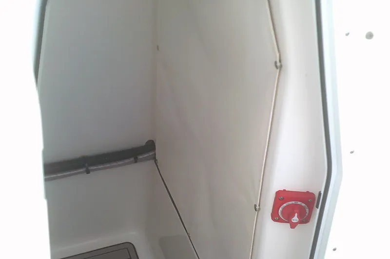 Slide: The Image of 2023 Sportsman Heritage 241 Center Console interior with red control knob. - 17