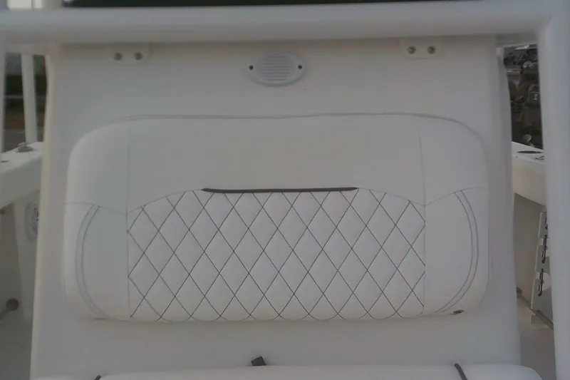 Slide: The Image of 2023 Sportsman Heritage 241 Center Console boat seat with diamond-stitched white upholstery. - 18