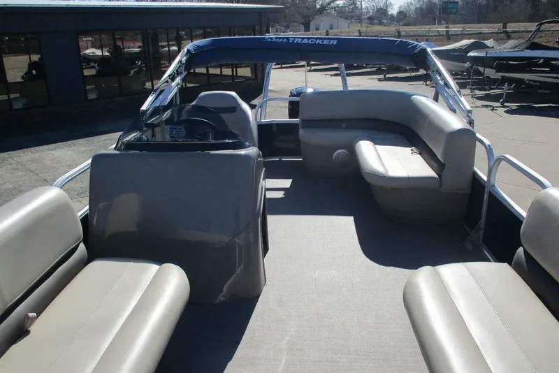 Slide: The Image of 2021 Sun Tracker Party Barge 18 DLX interior with seating and helm. - 3