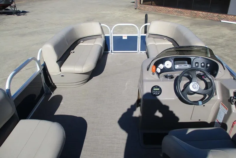 Slide: The Image of 2021 Sun Tracker Party Barge 18 DLX interior with seating and steering console. - 6