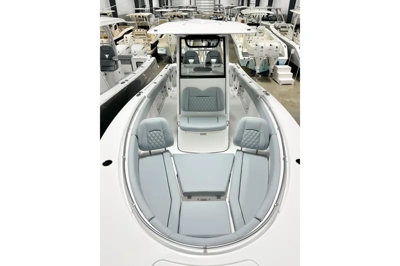 Slide: The Image of 2026 Sportsman Open 282 Center Console boat with spacious seating in showroom. - 11