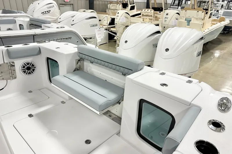 Slide: The Image of 2026 Sportsman Open 282 Center Console boat interior with seating and Yamaha engines. - 16