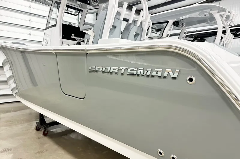 Slide: The Image of 2026 Sportsman Open 282 Center Console boat in showroom, side view. - 19