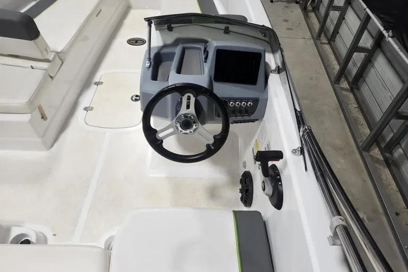 Slide: The Image of 2023 Tahoe T18 boat interior with steering wheel and control panel. - 7
