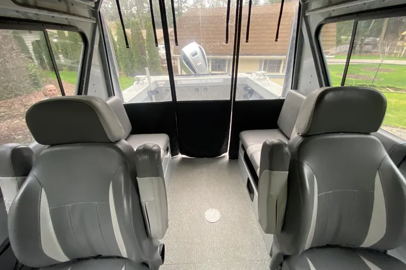 Slide: The Image of Interior of 2021 Hewescraft 210 Sea Runner ET Hardtop with gray seating and spacious layout. - 10