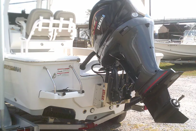 Slide: The Image of 2025 Sportsman Masters 227 Bay Boat with Yamaha outboard motor, rear view. - 1