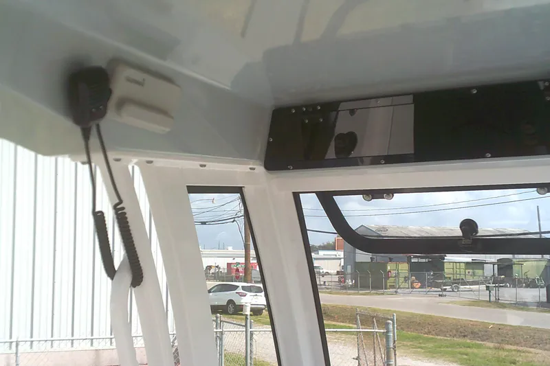 Slide: The Image of Interior view of 2025 Sportsman Masters 227 Bay Boat with communication equipment. - 14