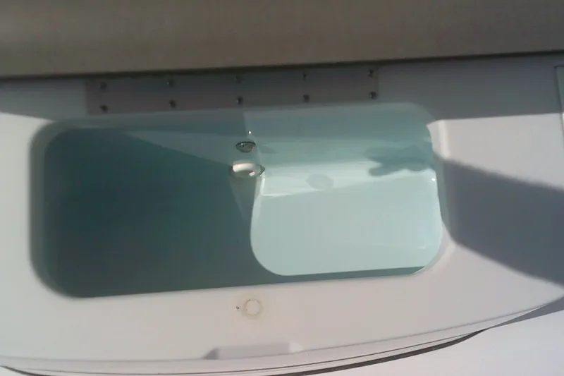 Slide: The Image of Livewell on 2025 Sportsman Masters 227 Bay Boat, filled with water. - 16