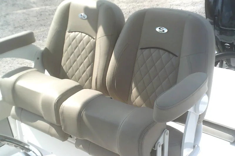 Slide: The Image of 2025 Sportsman Masters 227 Bay Boat seats with diamond stitching and armrests. - 18