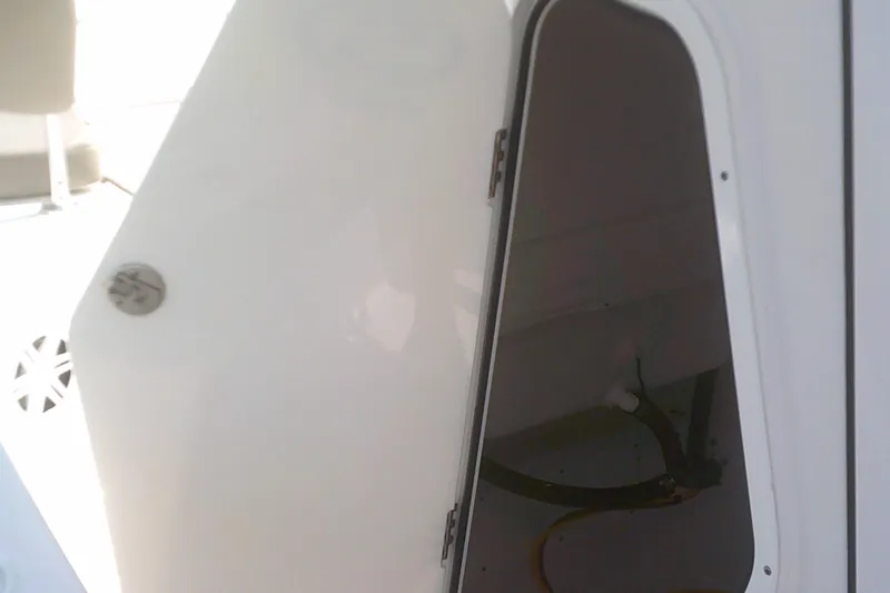 Slide: The Image of Open storage compartment on 2025 Sportsman Masters 227 Bay Boat. - 19