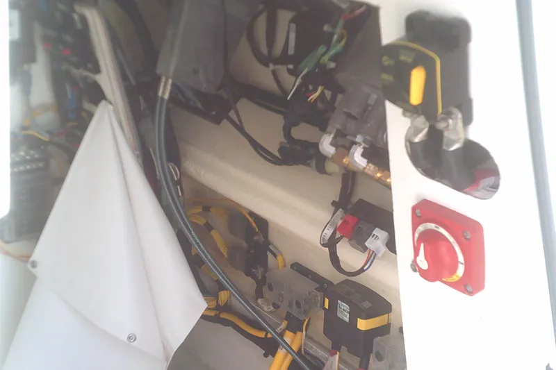 Slide: The Image of Interior wiring and components of a 2025 Sportsman Masters 227 Bay Boat. - 20
