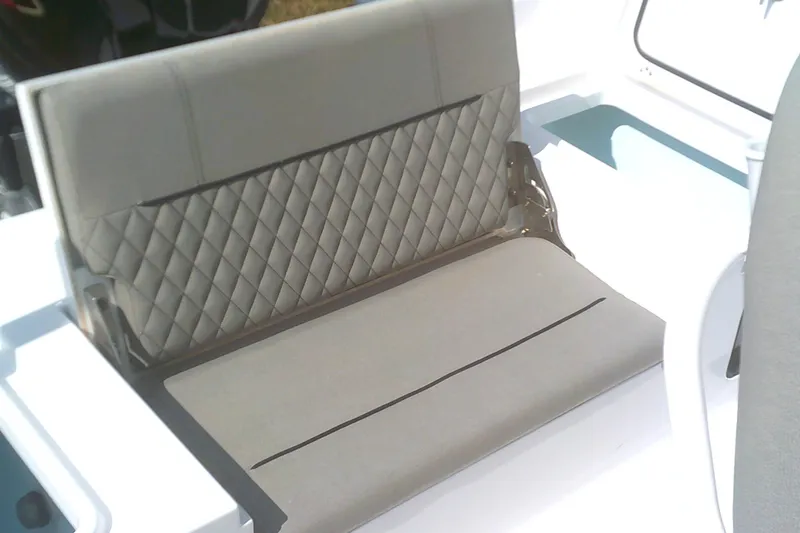 Slide: The Image of 2025 Sportsman Masters 227 Bay Boat interior seating with quilted upholstery design. - 9