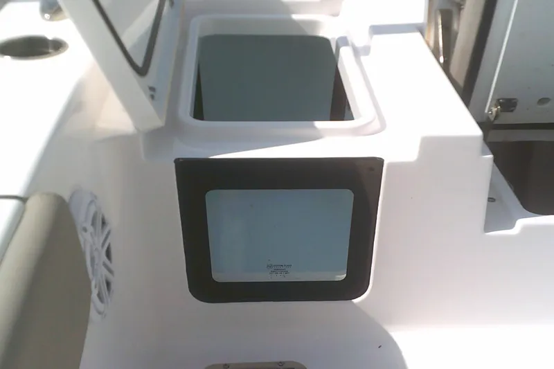 Slide: The Image of 2025 Sportsman Masters 227 Bay Boat storage compartments and speaker detail. - 12