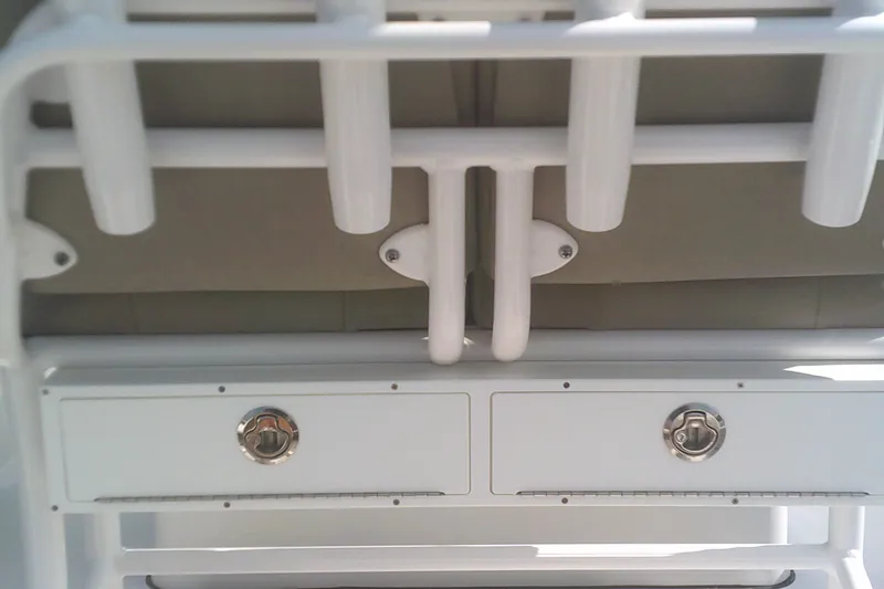 Slide: The Image of 2025 Sportsman Masters 227 Bay Boat storage compartments and rod holders. - 17