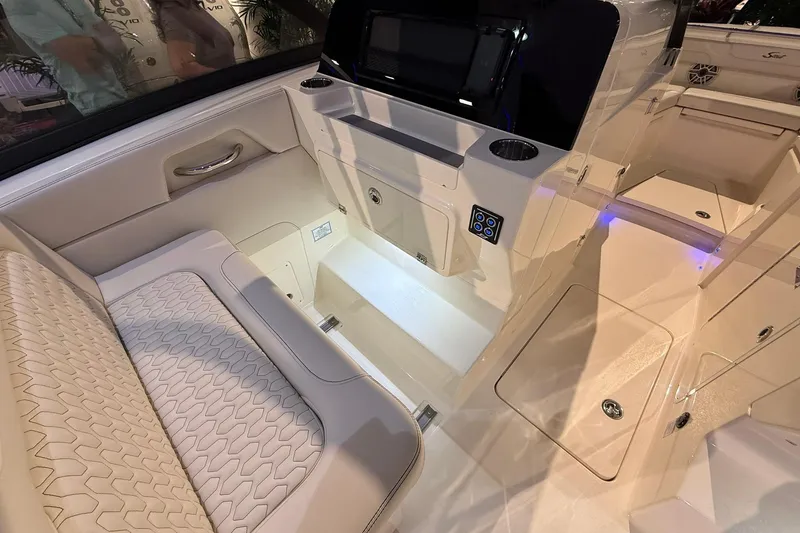 Slide: The Image of 2026 Scout 288 Dorado boat interior with luxurious seating and modern control panel. - 13