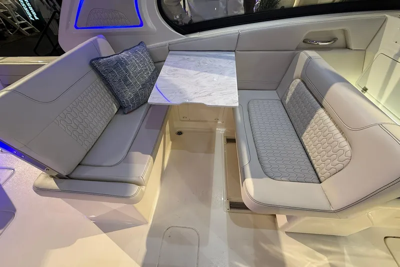 Slide: The Image of Luxurious seating area on 2026 Scout 288 Dorado boat with elegant upholstery and marble table. - 16