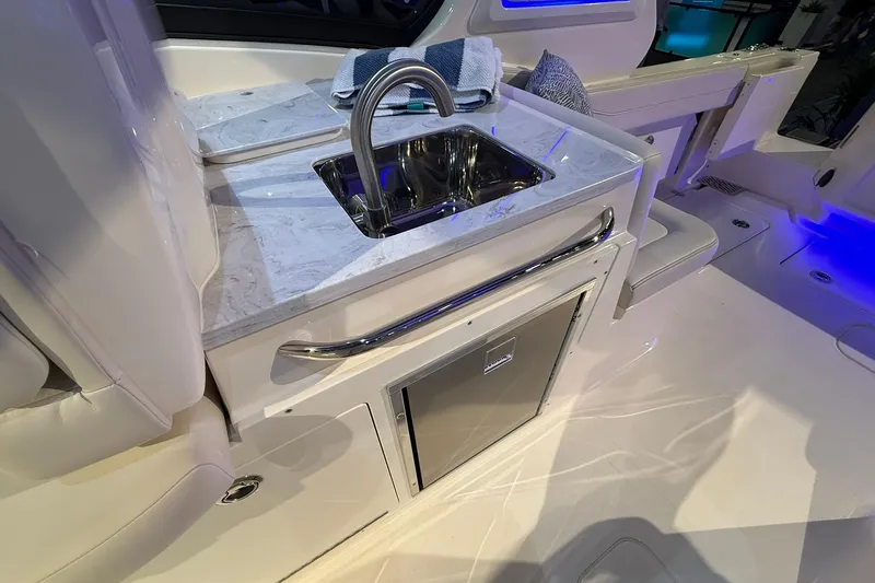 Slide: The Image of 2026 Scout 288 Dorado boat interior with sink and countertop. - 17