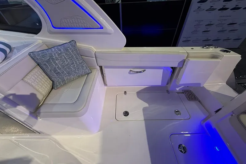 Slide: The Image of 2026 Scout 288 Dorado boat interior with seating and blue LED lighting. - 19