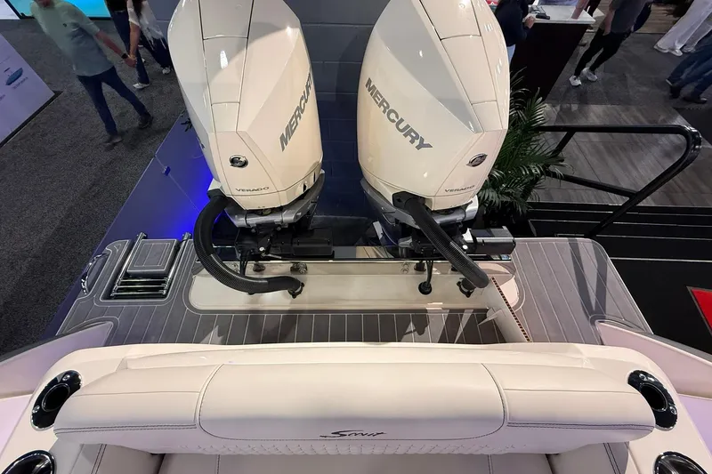 Slide: The Image of 2026 Scout 288 Dorado boat with dual Mercury Verado engines, viewed from above. - 26