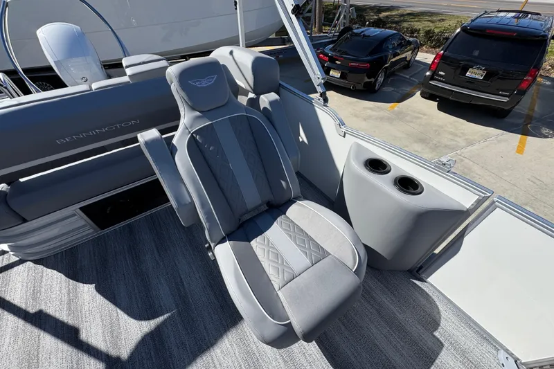 Slide: The Image of 2026 Bennington 22 MSB boat interior with luxurious seating and cup holders. - 26