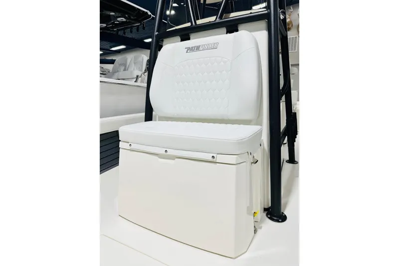 Slide: The Image of 2026 Pathfinder 2600 TRS boat seat with white cushioned backrest and storage compartment. - 11