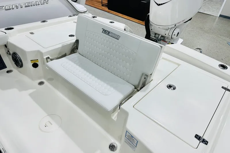 Slide: The Image of 2026 Pathfinder 2600 TRS boat interior with white seating and storage compartments. - 15