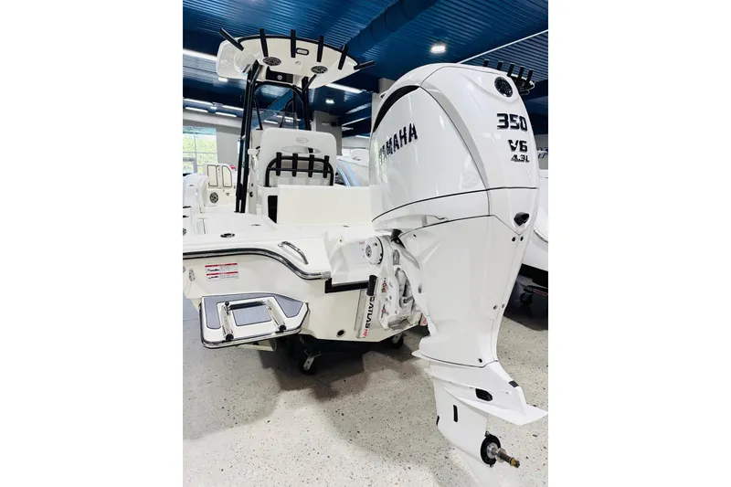Slide: The Image of 2026 Pathfinder 2600 TRS boat with Yamaha 350 V6 engine in showroom. - 18