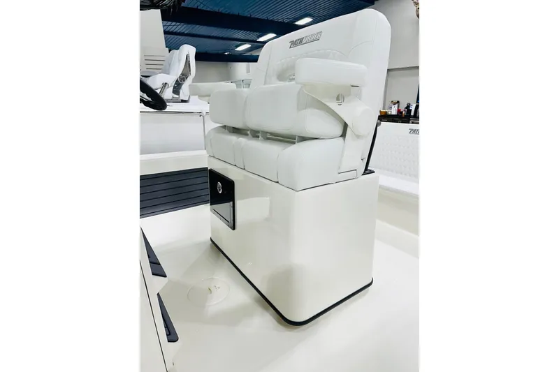 Slide: The Image of 2026 Pathfinder 2600 TRS boat seat with white upholstery and storage compartment. - 4