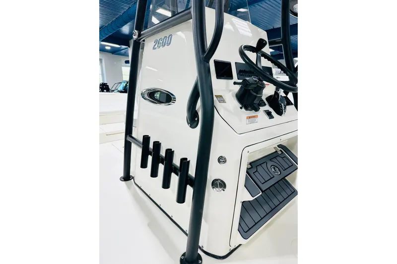 Slide: The Image of 2026 Pathfinder 2600 TRS boat console with steering wheel and rod holders. - 7