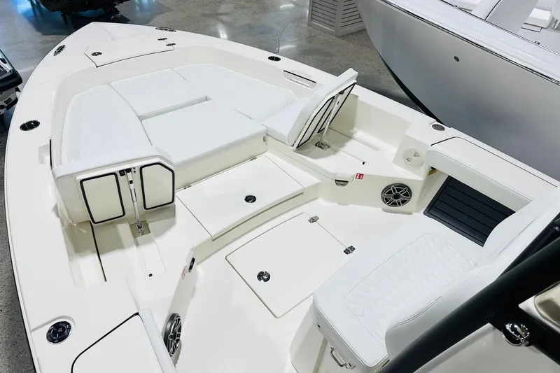 Slide: The Image of 2026 Pathfinder 2600 TRS boat interior with white seating and storage compartments. - 8