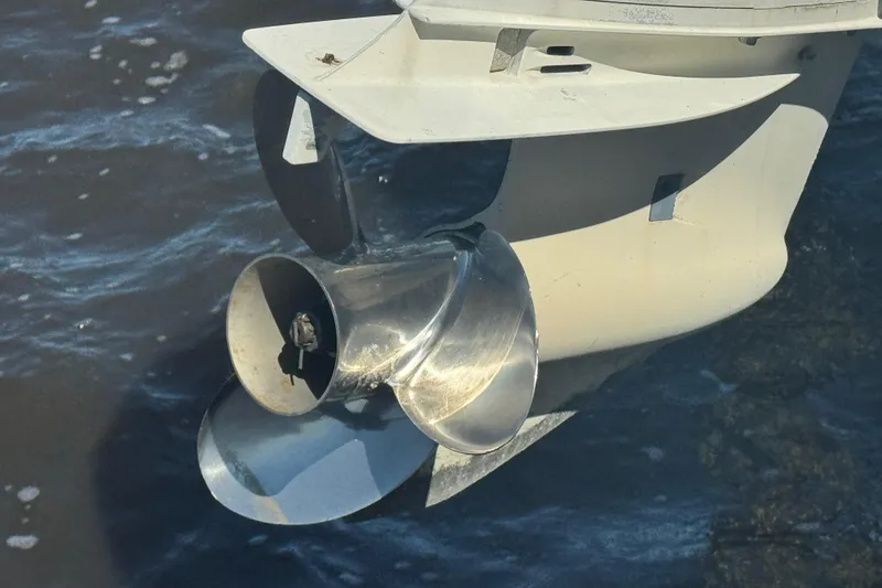 Slide: The Image of Close-up of a 1988 Boston Whaler Outrage 17 boat propeller in water. - 12