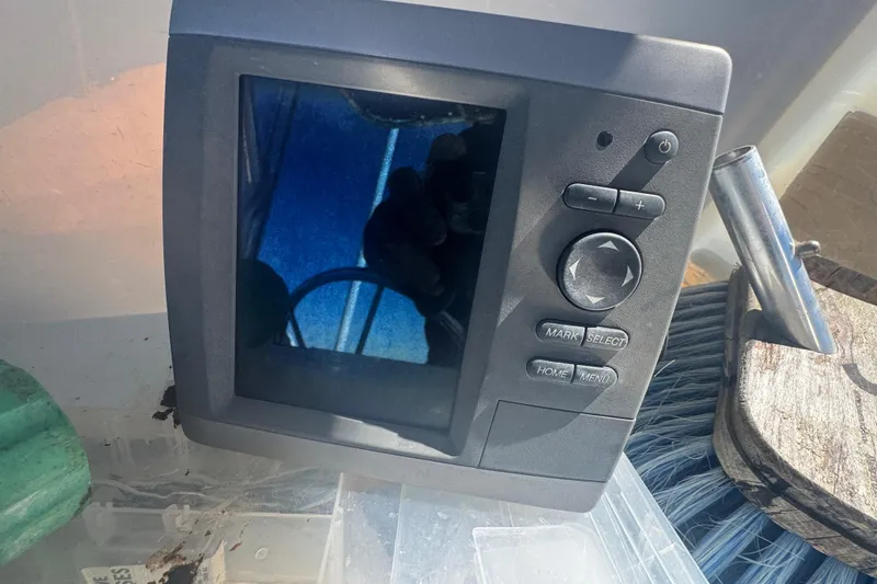 Slide: The Image of Fishfinder device on a 1988 Boston Whaler Outrage 17 boat dashboard. - 15